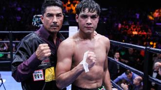 Omar Figueroa Jr. with his father